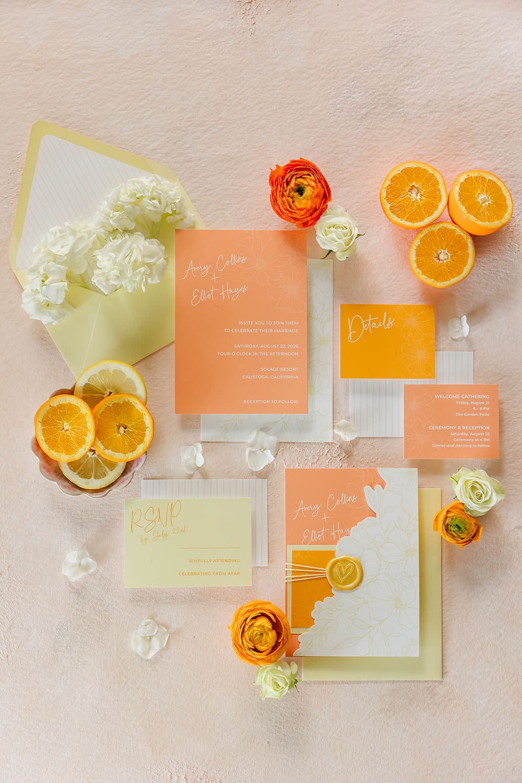 Flatlay of citrus-themed wedding invitation suite, part of 2025 wedding stationery trends featuring layered details and bold colors.